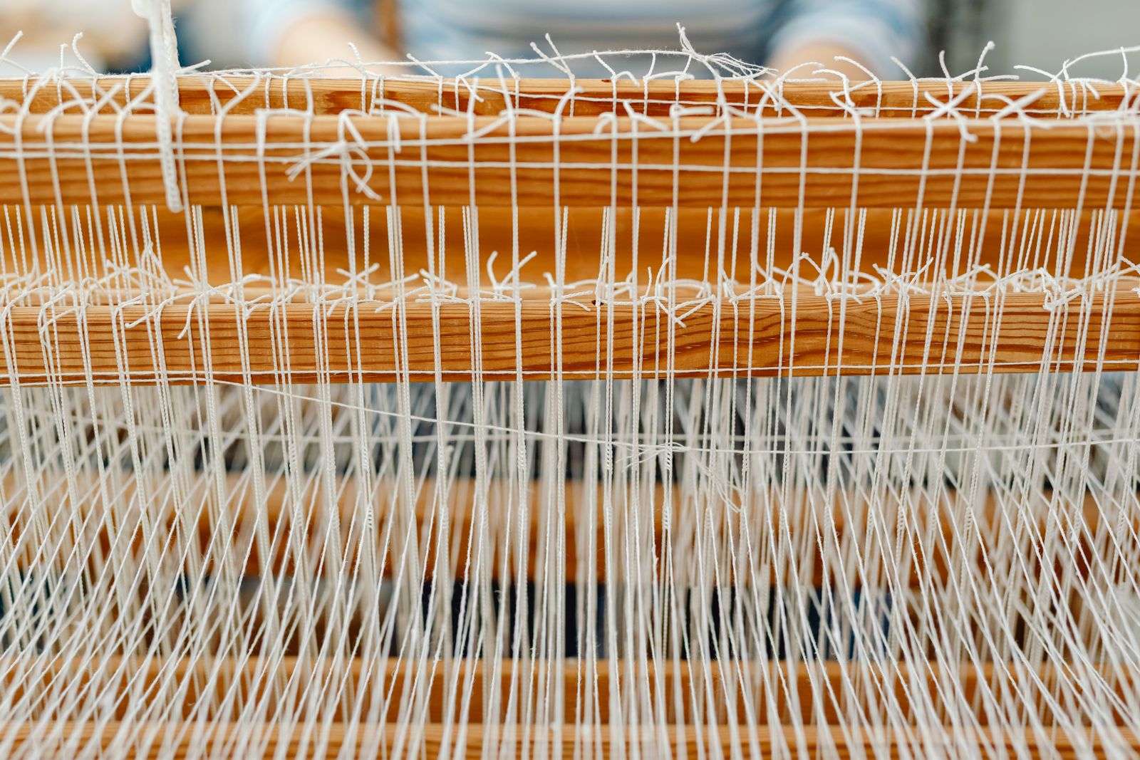 Textile weaving loom in operation